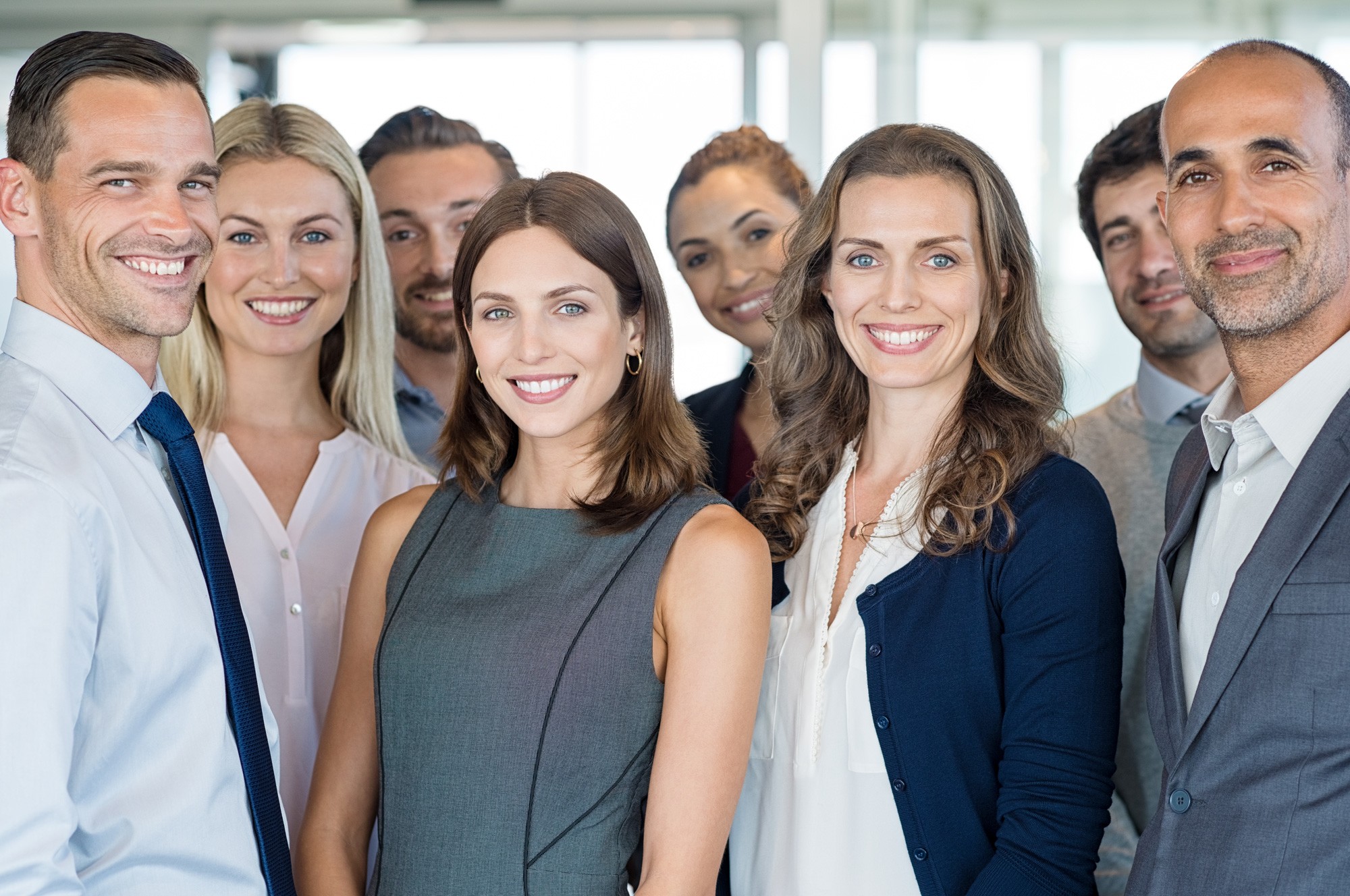 group of business people smiling at the camera