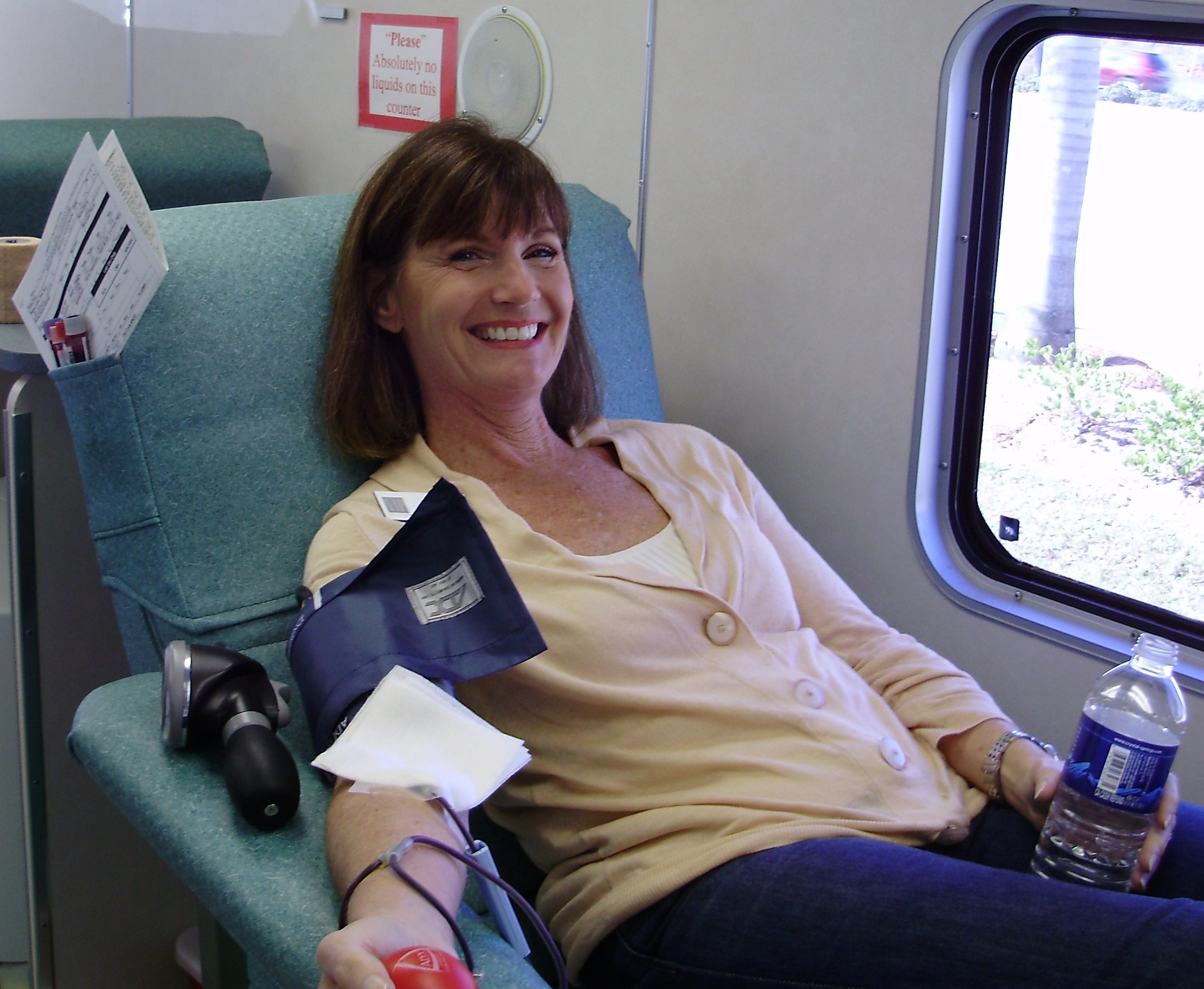 Picture of women donating blood through a blood drive